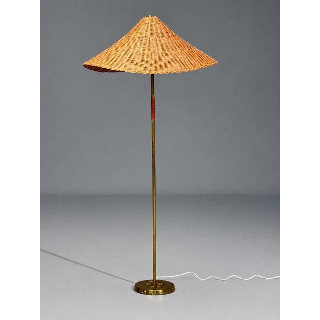 V. Soini Oy, Finnish Mid-Century Modern, Rare Floor Lamp, Brass, Leather, Rattan, Finland, 1950s A very rare polished...