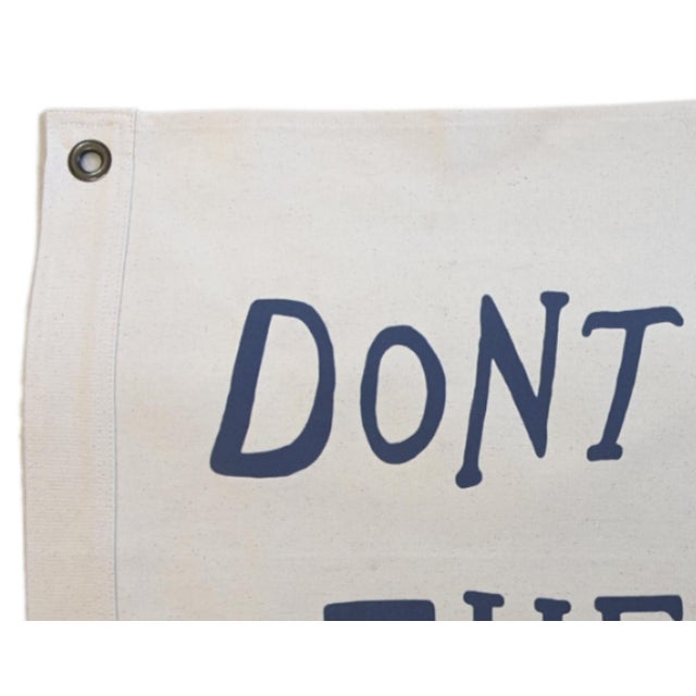 Custom-tailored all-cotton canvas nautical beachy flag that reads "DON'T GIVE UP THE SHIP" in off-white with navy blue...