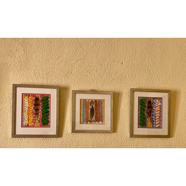A single real feather — the seed of the composition, not a finishing touch. Hilary Inglis painted outward from it each...