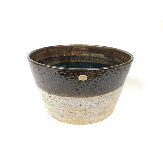 This extra-large bowl ceramic was designed by Sylvia Leuchovius and produced by Rörstrand. This bowl is marked as studio...