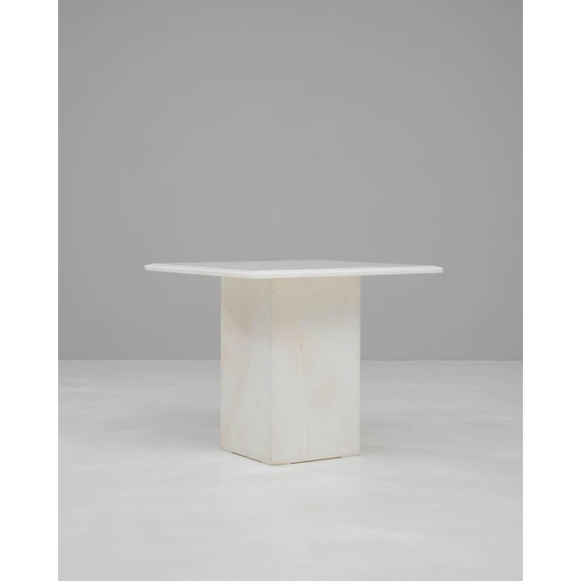 This 20th Century Italian marble coffee table showcases a refined, architectural silhouette that highlights the natural...