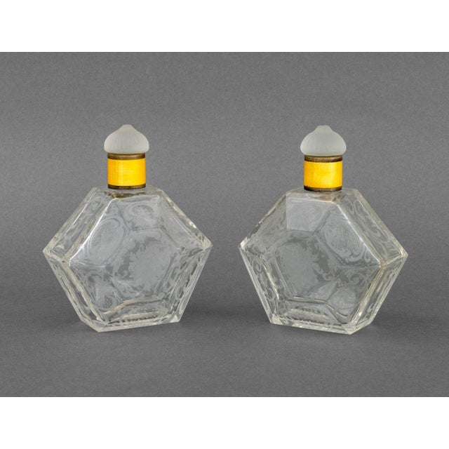 Collection of Five French Etched Glass Perfume Bottles, comprising: pair of hexagonal bottle with yellow enamel ferrule...