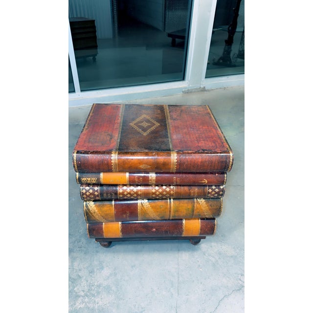 Mid 20th Century Maitland-Smith Stacked Leather Faux Books Side Table With Drawers. DETAILS 24"W × 18"D × 24.5”H...