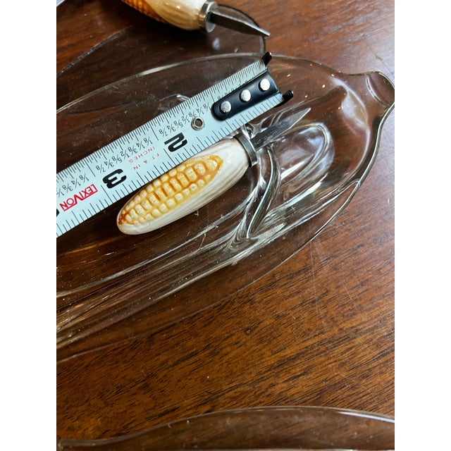 Up for consideration is a beautiful vintage collection of country core glass corn dishes with ceramic holders. These would...