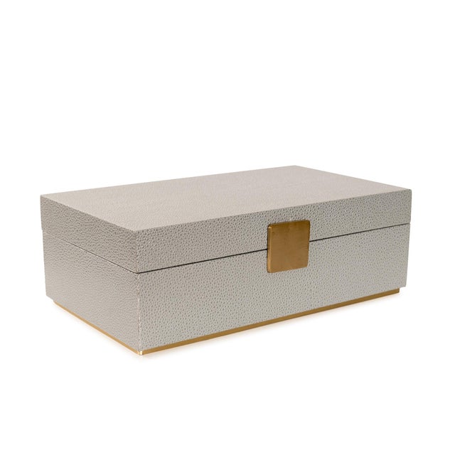 Sophisticated and functional, these decorative boxes feature a refined faux shagreen finish accented with warm gold...
