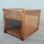 A beautifully crafted vintage boho chic side table, featuring warm oak construction adorned with finely woven cane...