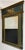 Early 19th century carved French Empire trumeau style mirror. Features a depiction of a chariot and horses on the main...