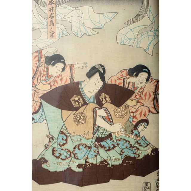 A striking antique Japanese kabuki woodblock print by Utagawa Kunisada I (1786–1865), later known as Toyokuni III,...