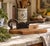 A beautifully timeworn antique wooden herb cutter with forged iron blade and handle, dating to the early 20th century....