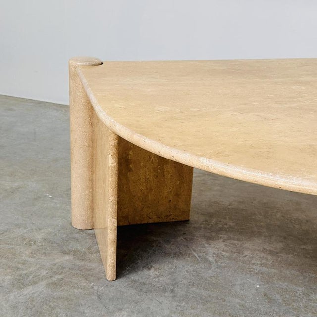 Width: 135 cm depth: 93 cm height: 44 cm a striking sculptural coffee table crafted entirely from warm beige travertine,...