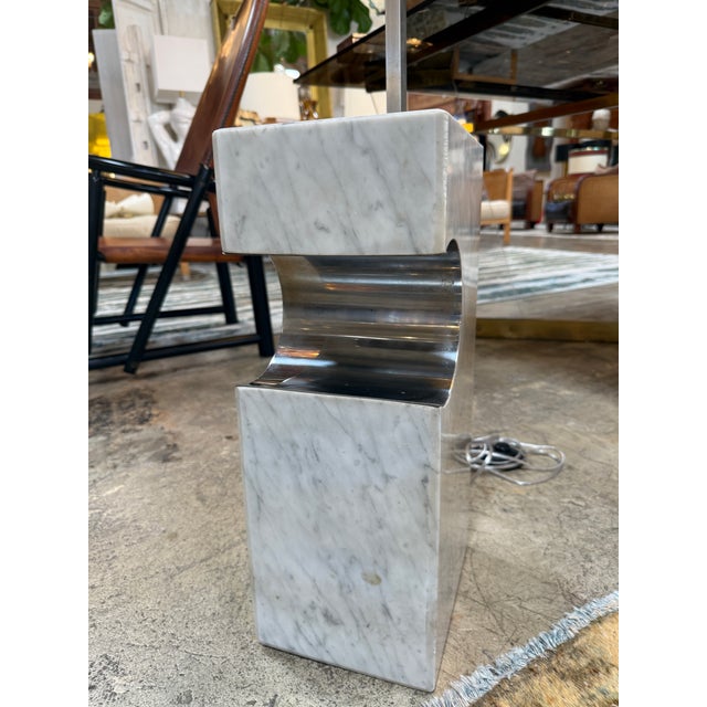 An elegant and striking mid-century modern "Arco style" arc floor lamp produced in Italy during the 1970s. This piece...