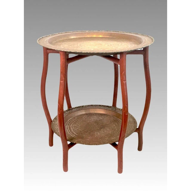 Useful as well as very nice, a Mid 20th. Century Chinese 2-tier folding table with 2 scalloped rim round brass trays with...