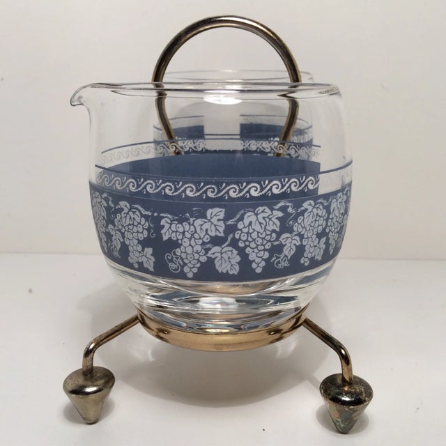 Mid-Century Modern Cream and Sugar sits in a caddie. Has a grape design.