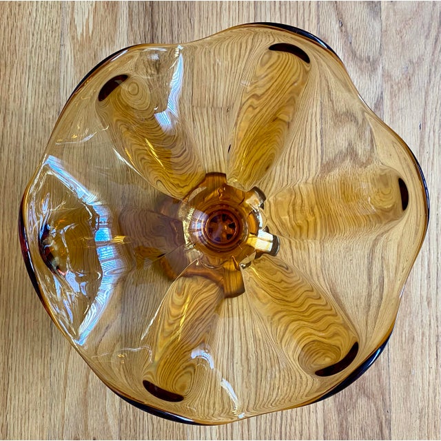This charming vintage Viking Art Glass bowl is in excellent condition! It is pale amber with six petals, a ruffled rim,...