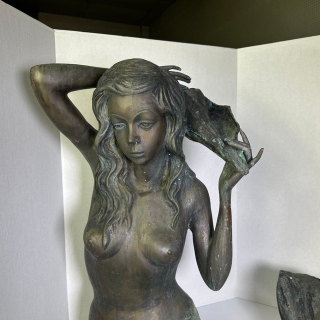 This bronze mermaid fountain is a fabulous vintage piece. The patina and details make this fountain a beautiful unique...