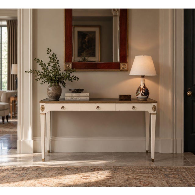 Maison Jansen Style, Neoclassical Console Table, White Painted Wood, Gilt Bronze, Mirror, France, 1970s A Neoclassical...