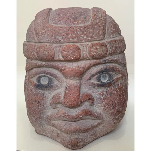 Vintage Olmec head. The Olmec colossal heads are stone representations of human heads sculpted from large basalt boulders