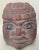 Vintage Olmec head. The Olmec colossal heads are stone representations of human heads sculpted from large basalt boulders