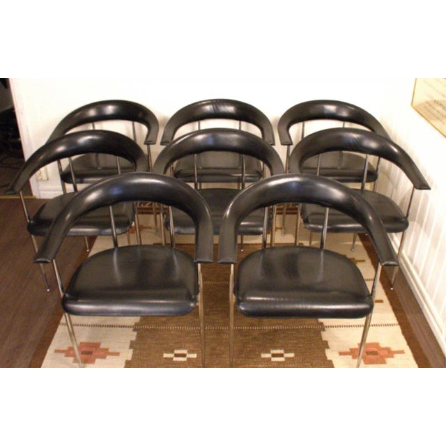 Eight very fine dining armchairs in leather and chrome steel, designed by Giancarlo Vegni & Gianfranco Gualtierotti for...