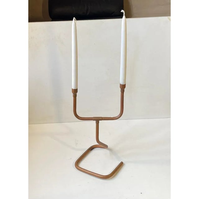 Decorative candelabra fashioned from bend solid copper pipes. Naturally patinated over the years. Anonymous danish metal...