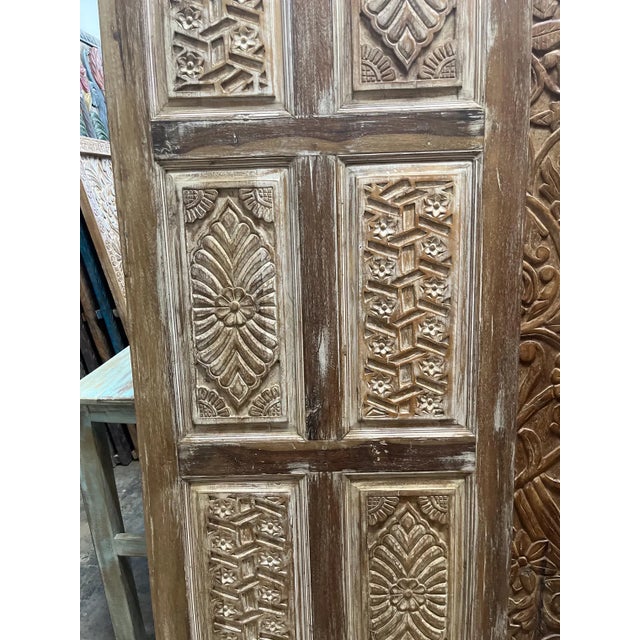 Elevate your interior with this exquisite antique hand-carved wooden door, featuring intricate floral motifs meticulously...