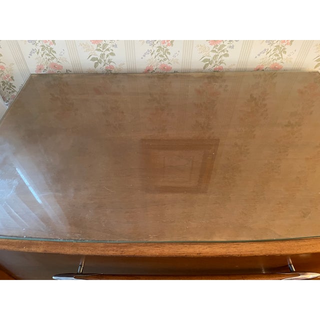 Mid-century walnut high boy, crafted in the 1950s. This piece features rich walnut grain, clean lines, and features four...