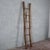 This antique solid-wood ladder is a genuine vintage piece. Characterized by a rustic and slender design, it evokes the...