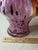 Elegant Murano-style art glass torso vase featuring a stunning pink body accented with black speckles and colorful...