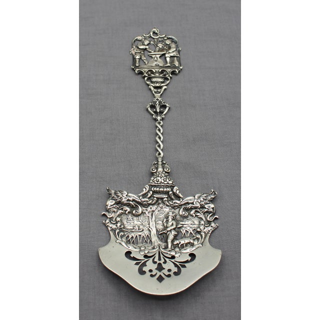 American Colonial Revival, c. 1885-1910, sterling silver pierced server. Baroque style featuring a hunter & dog, village...