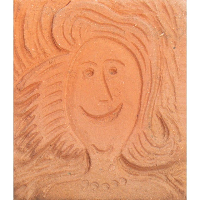 A studio pottery tile by the American artist Mark Bulwinkle (born 1946). This rectangular tile features the impressed...
