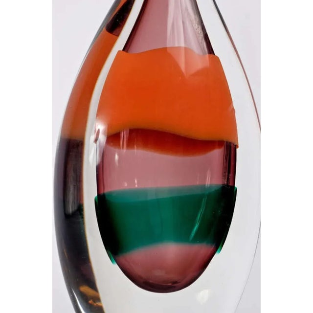 Heavy Murano glass, for Salviati. Clear glass outside, amethyst inside, with orange and green stripes.