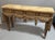 Neoclassical carved and painted Italian console table. The top is Faux painted to look like marble, and the front is...