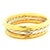 A beautifully substantial trio of Italian hinged bangle bracelets, crafted in 18-karat yellow and white gold and dating to...