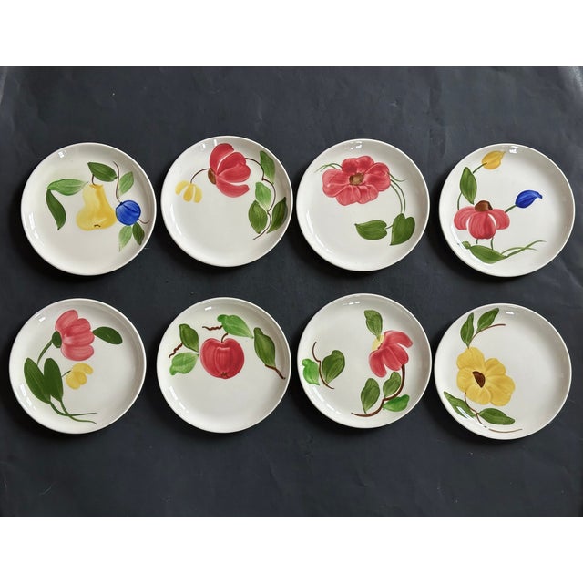 Made circa 1950 in Lincoln, Illinois by Stetson, each plate in this set of eight (8) small dishes has a different hand-...