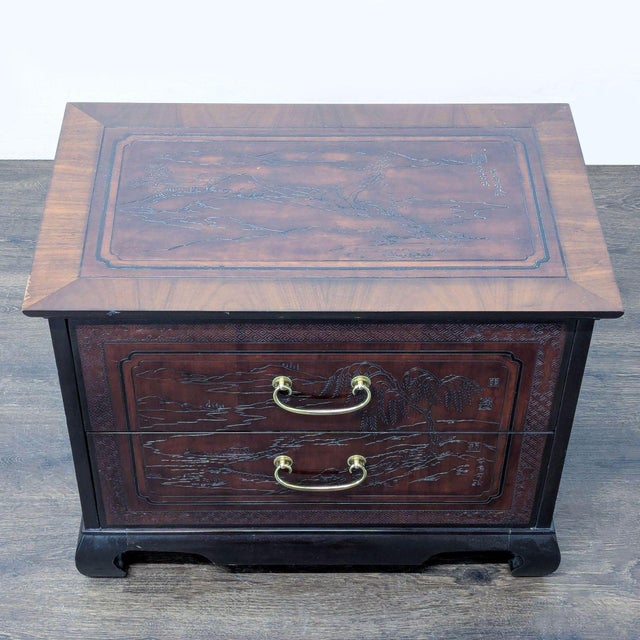 Chinoiserie 2 drawer nightstand with carved top and drawers, brass hardware, and Ming style base. Brand: Drexel Heritage....