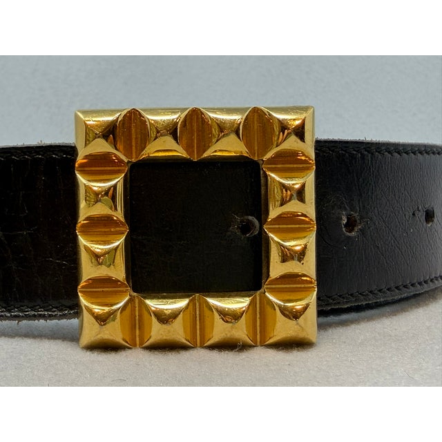 Hermes Medor Black Leather Belt with Gold Tone Buckle Leather strap measures 44.50" in length and 1.25" width Buckle...