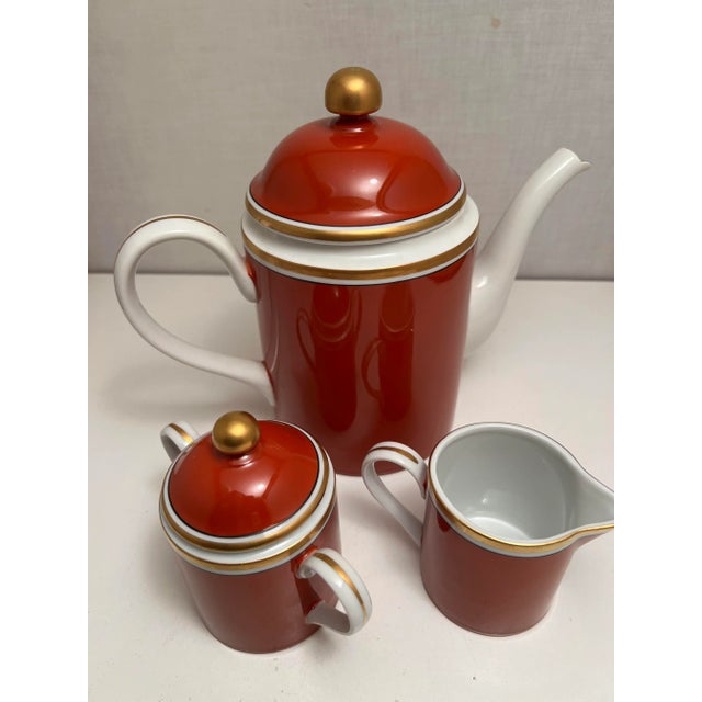 On offer is the classic Fitz & Floyd Medallion d'Or terra cotta coffee/tea set. The coffee pot is six inches tall (plus...