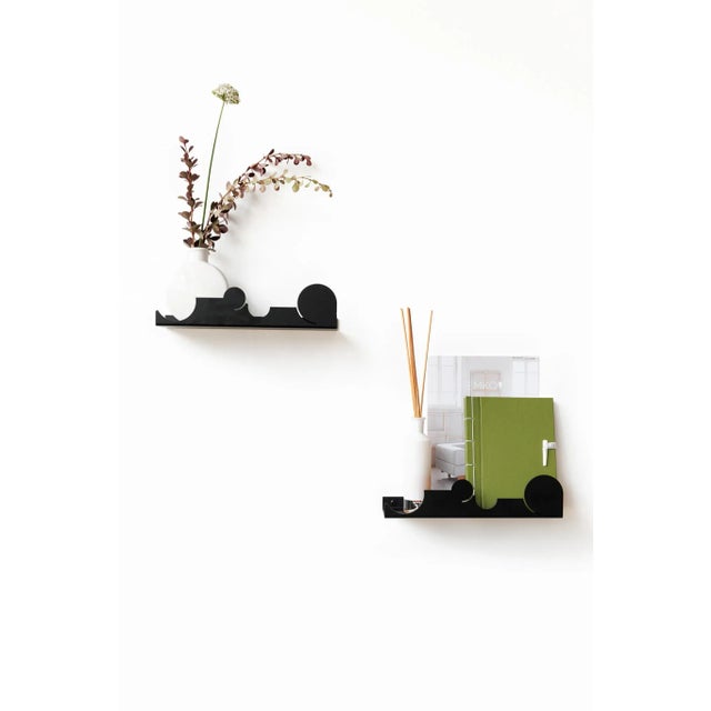 EMKO team in collaboration with Etienne Blondel created decorative floating shelf NVMD. Name reflects the idea of...