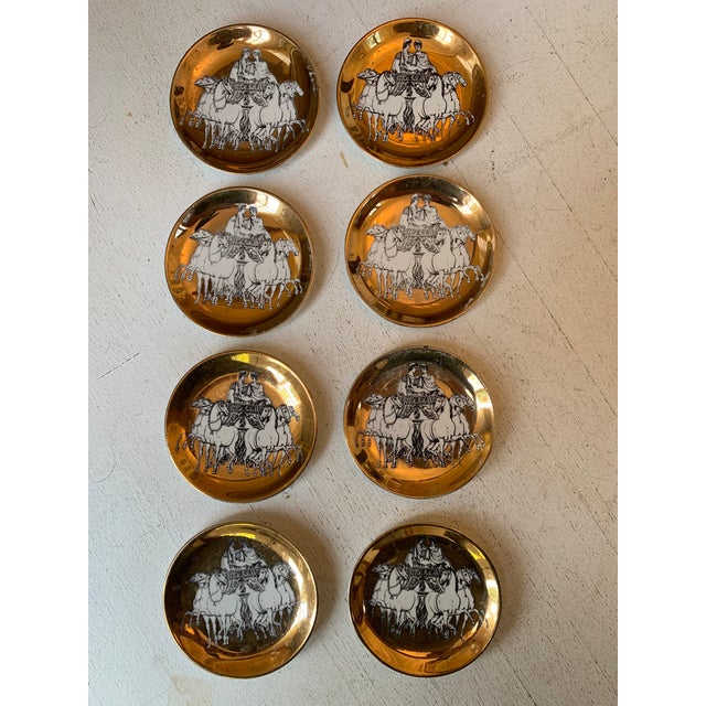 P. Fornasetti ROMAN QUADRIGA . Plates Set of 8 : white roman quadriqua on brass back. Signed on the bottom: FORNASETTI-...