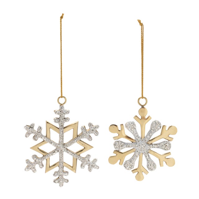 Enhance your holiday decor with the Jeweled Metal Snowflake Ornament. Featuring festive gold tones and a chic lacquer...