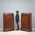 Pair of mahogany cupboards. Central paneled door, mirrored mahogany crotchet enriched with leaf carvings, scrolls, and...