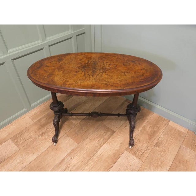 Victorian Oval Walnut Centre or Hall Table The table has very attractive carved legs set on ceramic castors, the table top...