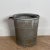 A large antique zinc bucket with ribbed decoration.