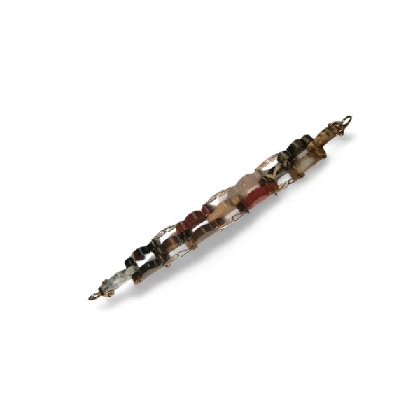 Bold 18K yellow gold designer link bracelet featuring 13 hand-carved multi-colored agate segments. Each agate showcases...