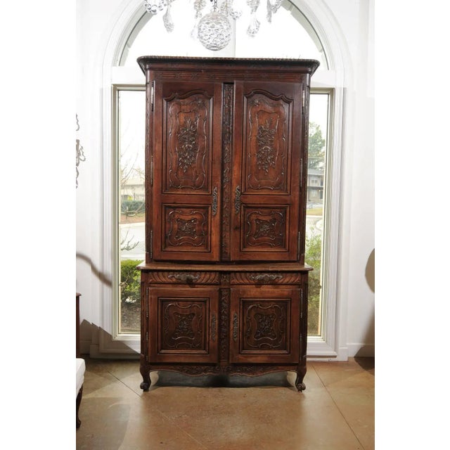 An early 19th century French carved oak buffet à deux-corps from the Picardie region of France. This tall French two-piece...