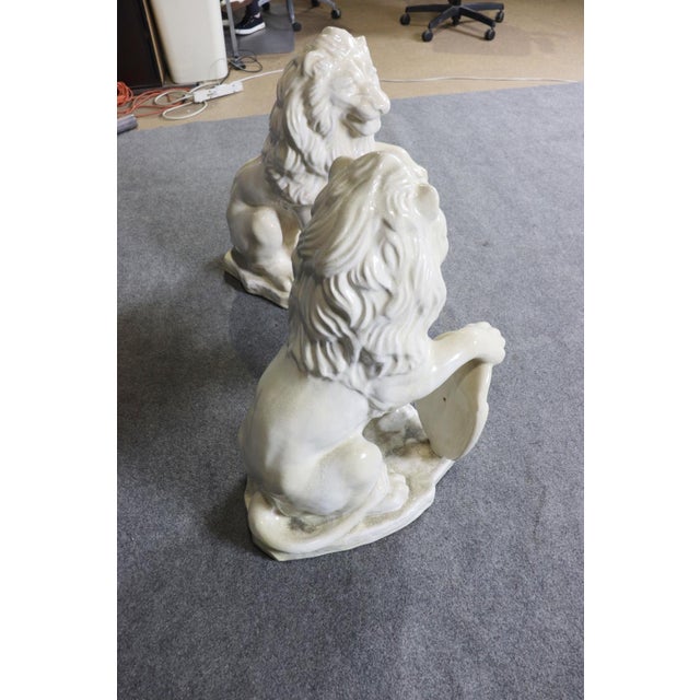 Pair Large White Glazed Ceramic Figures of Entryway Lions Paws Raised on Shield For Sale - Image 11 of 12