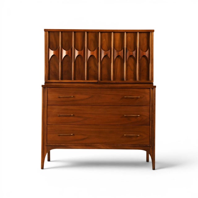 This Kent Coffey Perspecta highboy dresser and armoire from the 1960s is one of the most statement-making pieces from one...