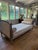 Vintage Oly daybed. Upholstered in their sand colored herringbone fabric with silver leaf frame. Crack on one side of the...