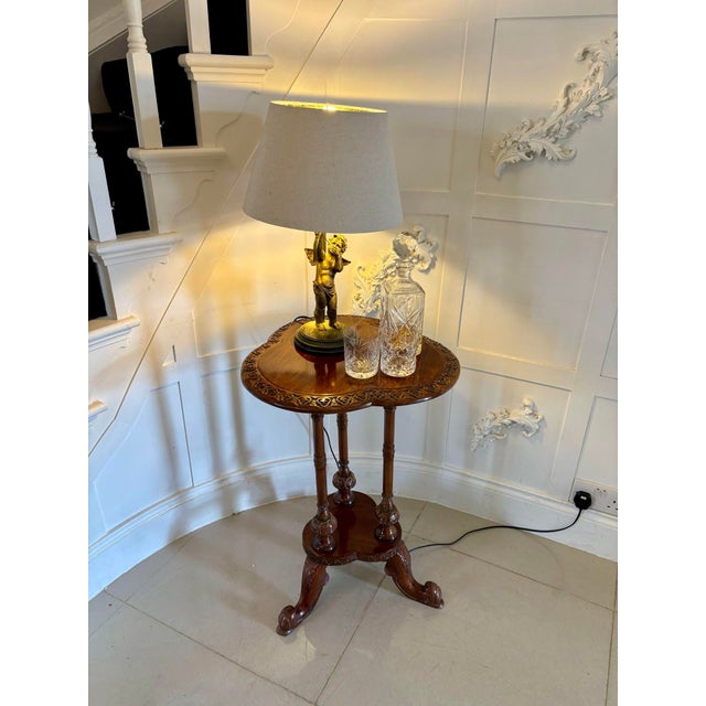 Antique Edwardian carved mahogany lamp table having a quality mahogany attractive shaped top with a carved edge supported...