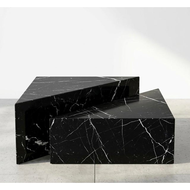 Nesting coffee table set in nero marquinia marble this elegant set consists of two geometric coffee tables, precisely...